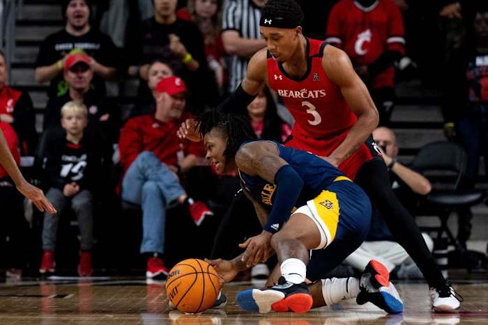La Salle Explorers guard Khalil Brantley (5) recovers after losing the ball as Cincinnati Bearcats guard Mika Adams-Woods (3) guards him in the first half of the NCAA men s basketball game at Fifth Third Arena in Cincinnati on Saturday, Dec. 17, 2022. Ncaa Basketball La Salle Explorers At Cincinnati Bearcats Ac